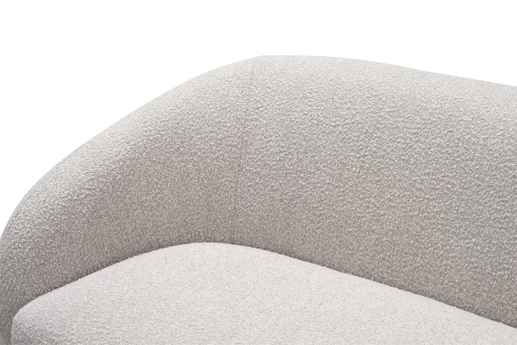Close-up of a textured quartz coloured cushion boucle fabric on a white background