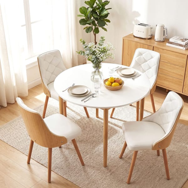 Dining setting with 4 chairs set for a meal for 2 people