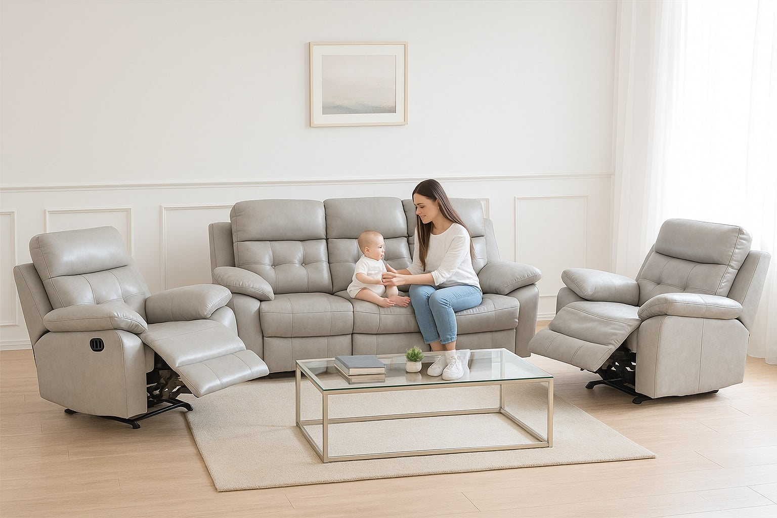 Woman and child sitting on a gray recliner in a modern living room.