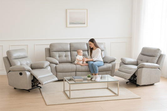 Woman and child sitting on a gray recliner in a modern living room.