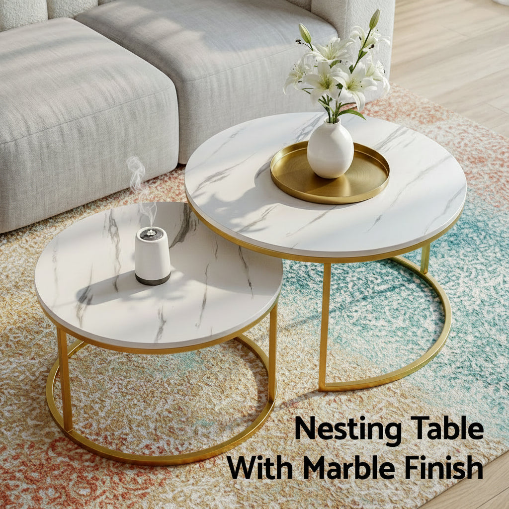Nesting tables with marble finish and gold frames in a living room setting.