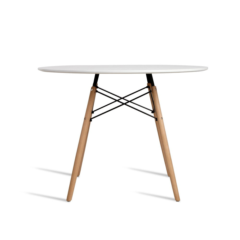 Round table with white top and wooden legs